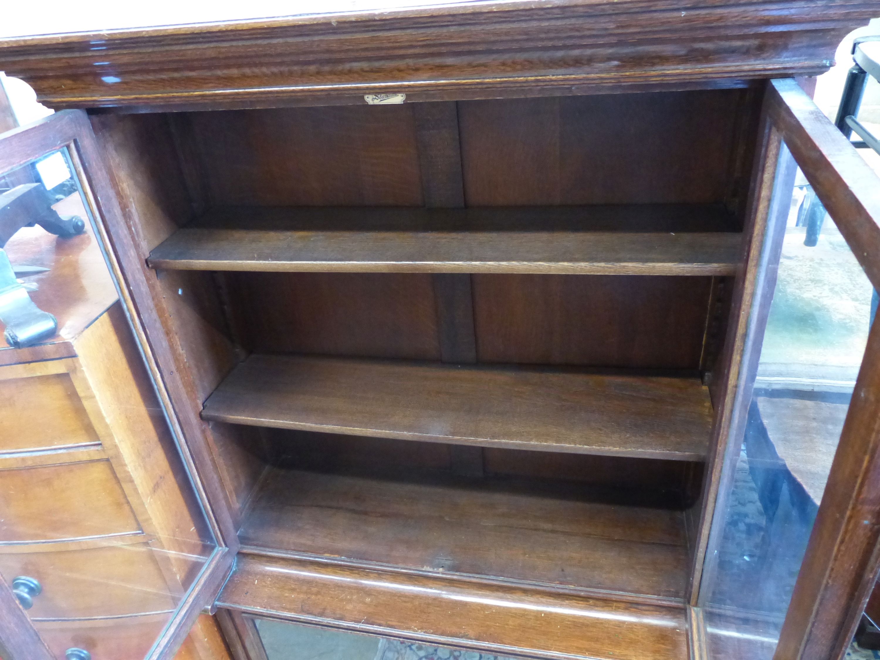 A 1920's standard oak bookcase, length 97cm, depth 37cm, height 138cm